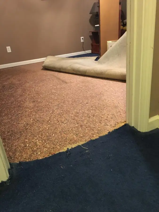Carpet pad removal revealing water damage during Drying & Dehumidification in Creswell
